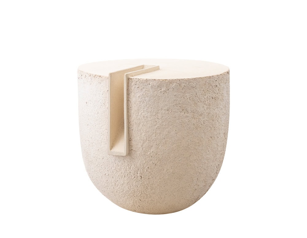 Stoneware vessel with a sculptural cut detail combining raw texture and smooth geometry for a contemporary decorative accent.