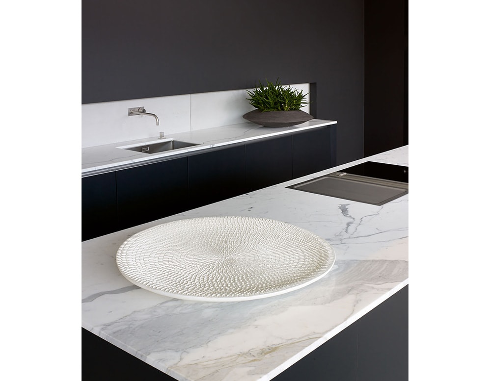 medium plate made from ceramic with a white tone and circular finishes