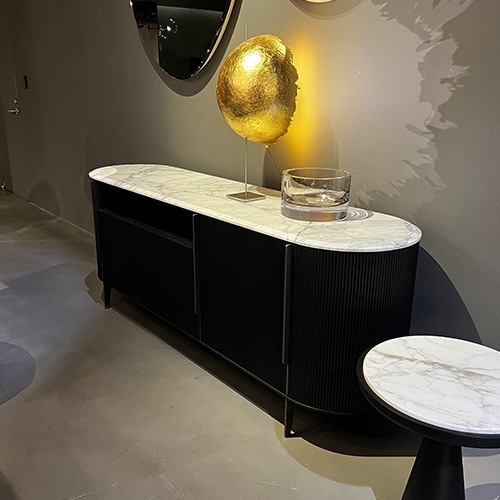 Black sideboard with doors, drawers, open module and white marble countertop