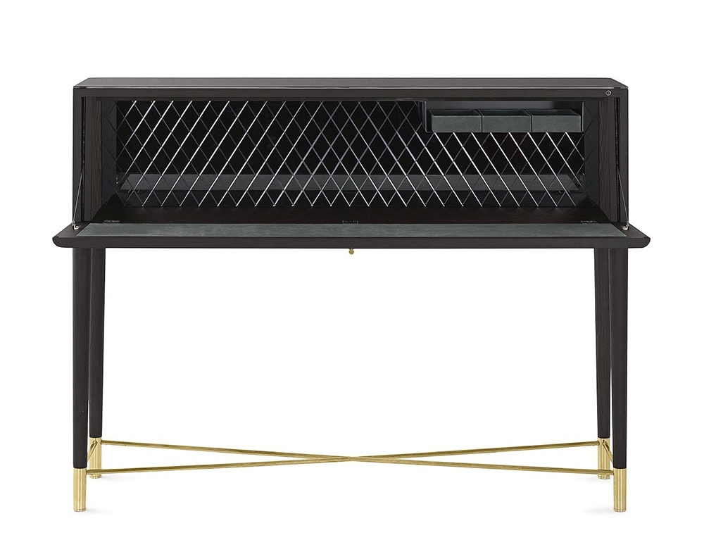 Writing desk with flap door in black wood with borders of satin brass lacquered metal parts and bright licorice painted glass top and inside back with a rhomboidal engraved pattern on the inside glass back