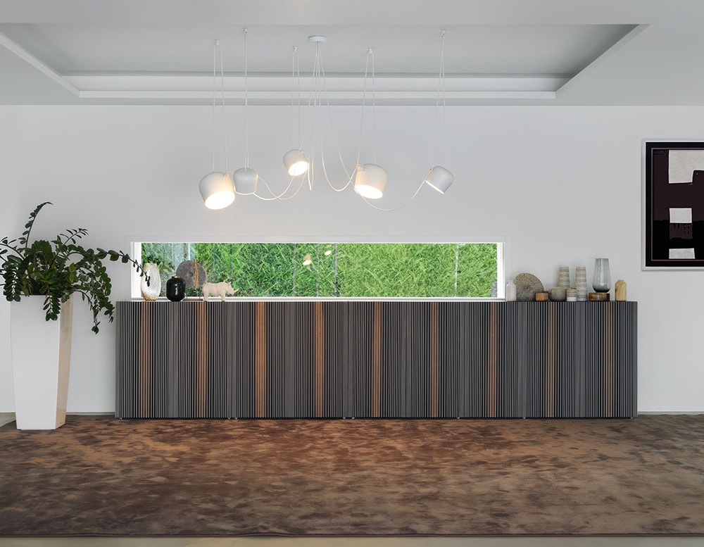 tables made from wood and metal varying their design depending on the point of view in a living room.