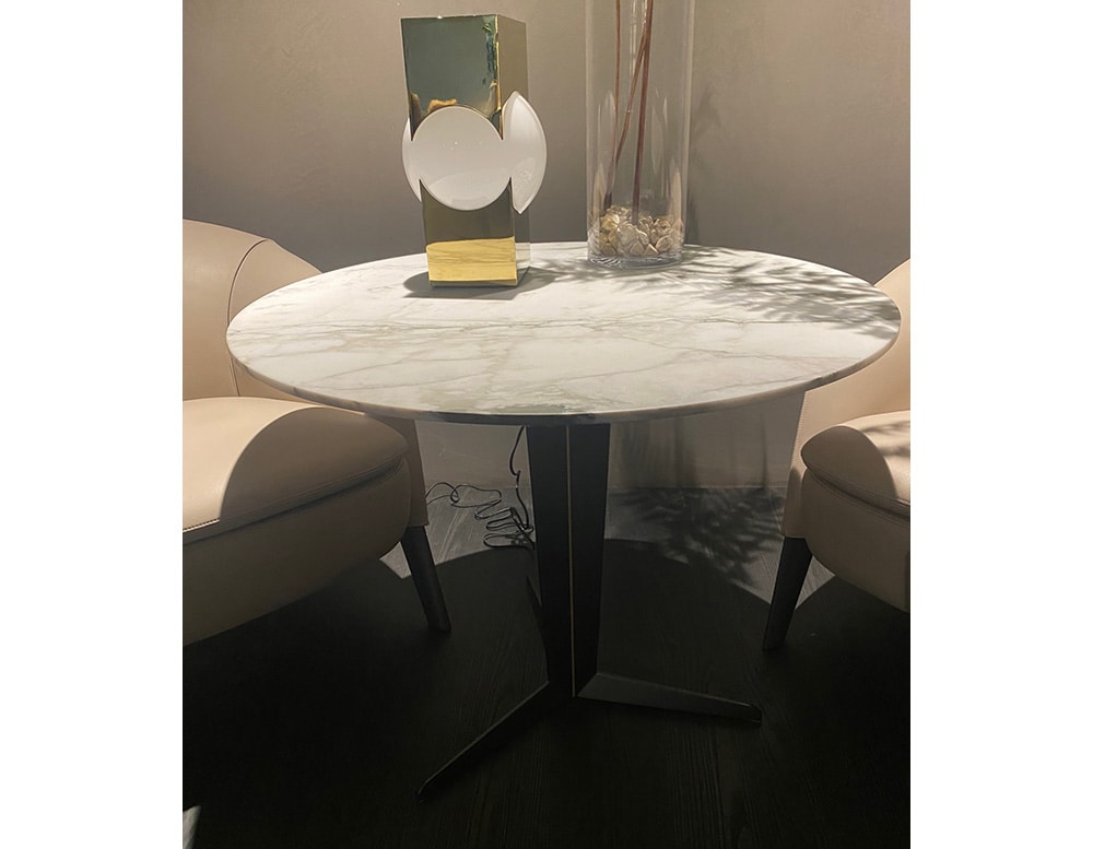 small circular table made of pewter and Calacatta Gold marble top