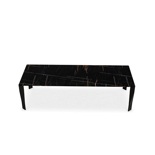 dining table made with an aluminum base and polyurethane foam and finished in Sahara Noir Stone on a white background