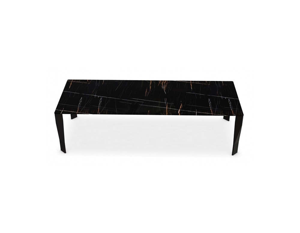 dining table made with an aluminum base and polyurethane foam and finished in Sahara Noir Stone on a white background