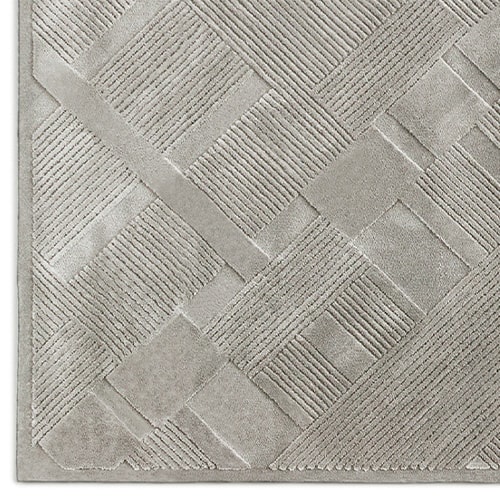 woven rug in different levels in its finish, in an ice color tone