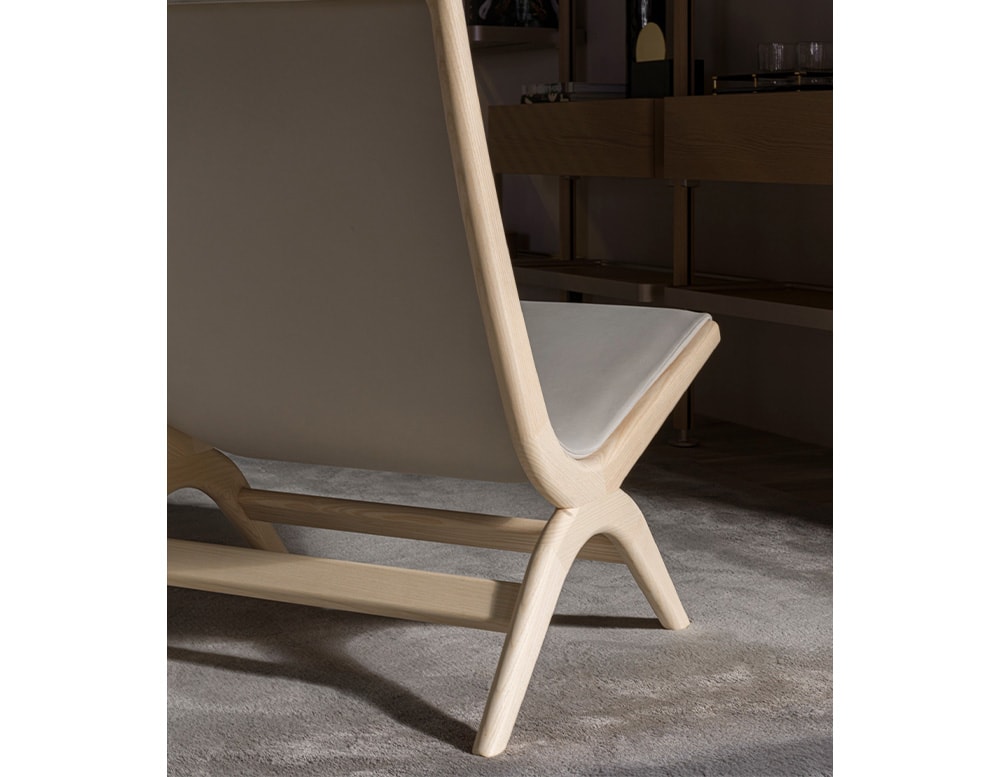 chair made with light brown oak wood base and white leather