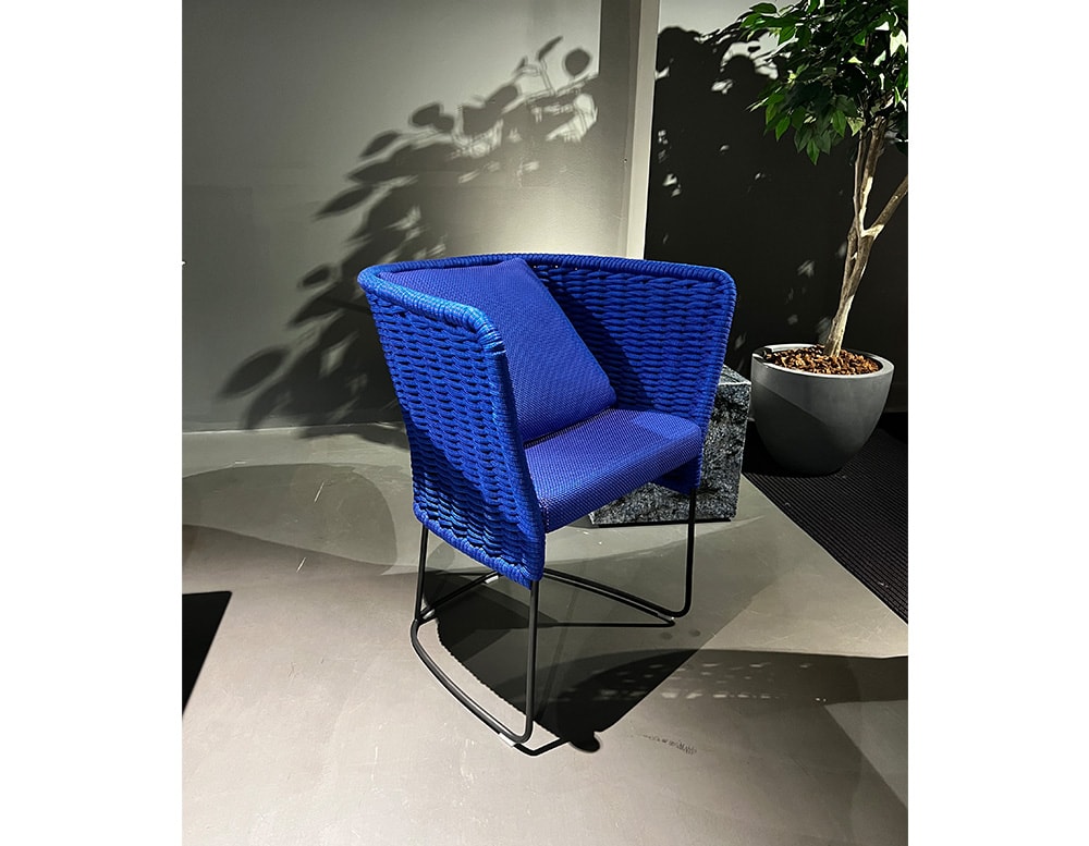 purple blue dining chair made by hand fabric and steel base.