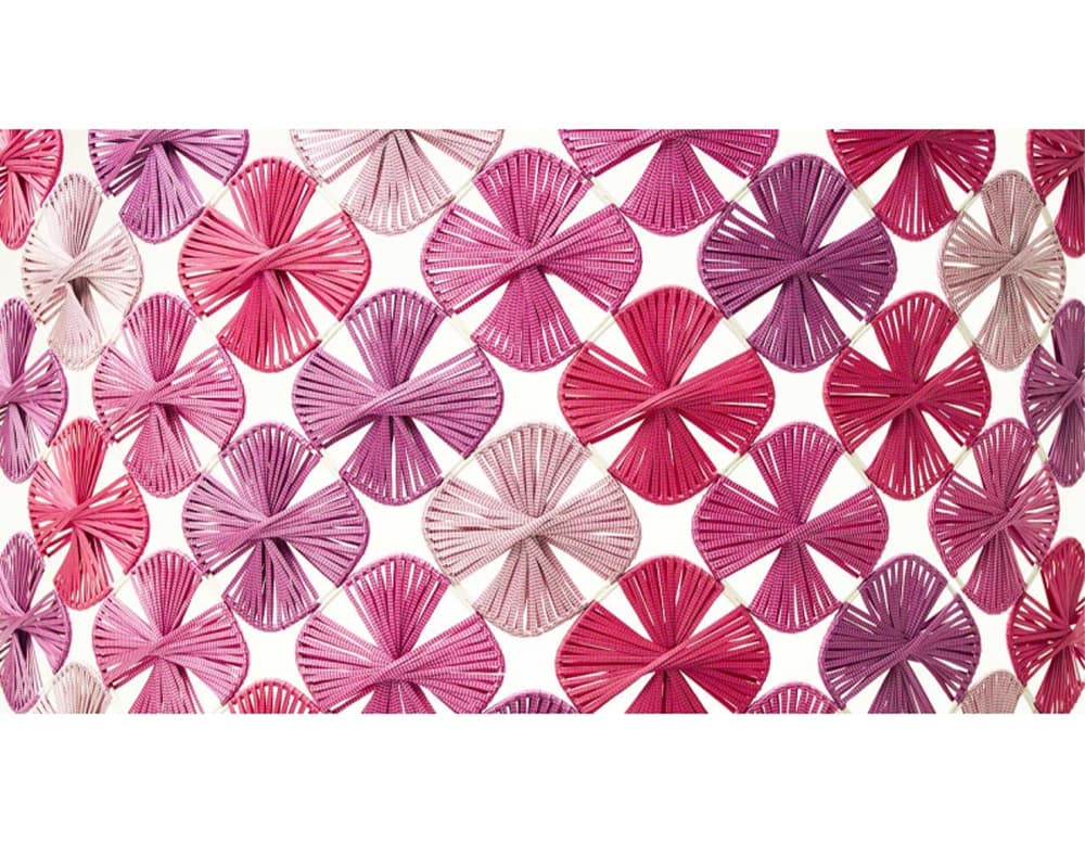 Lotus rug with flowers in different shades of pink with metal structure covered in rope yarn