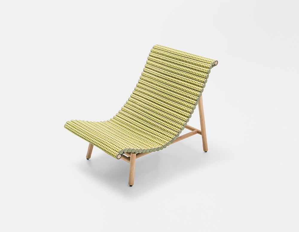 A green tatami lounge chair, with wooden legs