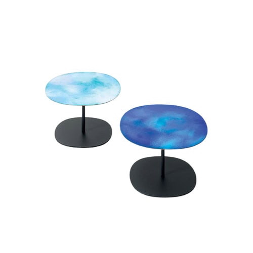 Set of two modern side tables with round tops in blue watercolor-like finishes. Each piece stands on a slim black pedestal base, blending artistic design with practical function.