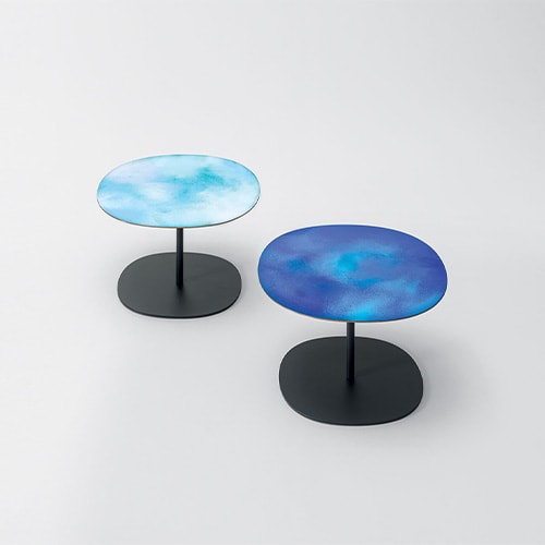 Two side tables with black base and top in different shades of blue