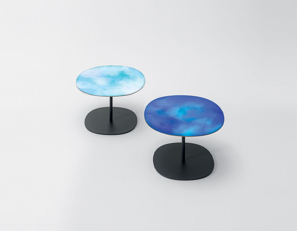 Sky colored side table on white background