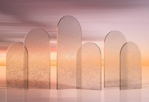 A series of arched glass panels reflecting a warm, golden sunset, creating a dreamy and ethereal ambiance with soft gradients and light