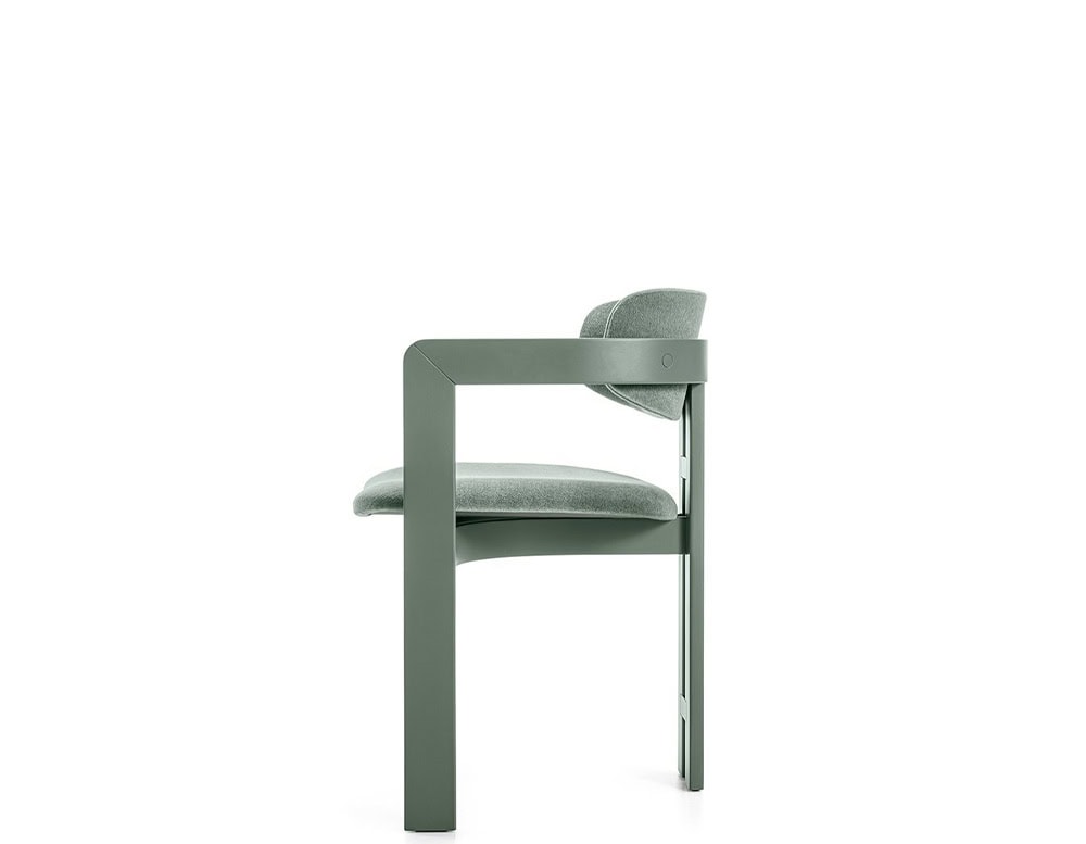 Curved ash wood chair upholstered in green leather on a white background.