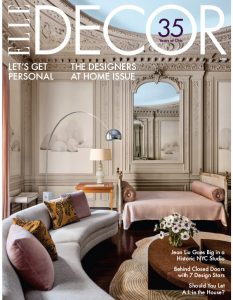 A cover of ELLE DECOR magazine featuring an elegant living space with classic architectural details, pastel furniture, and soft lighting.