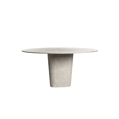 oval and square dining table made with a tube covered in dust and its top in lava stone in various shades of gray