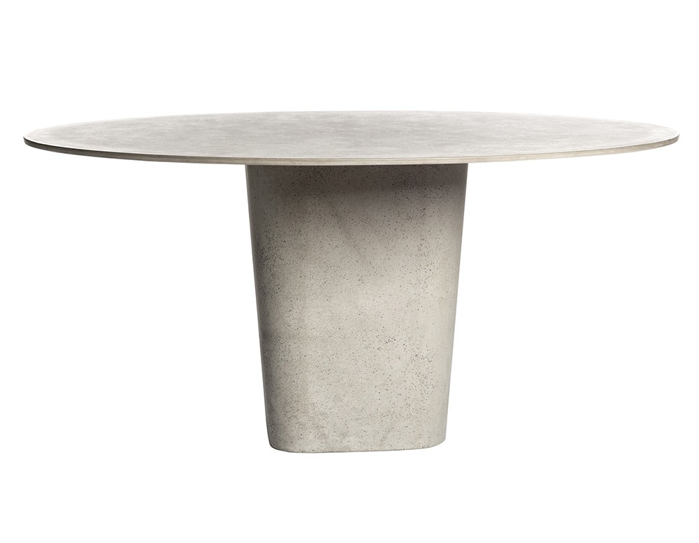 oval and square dining table made with a tube covered in dust and its top in lava stone in various shades of gray