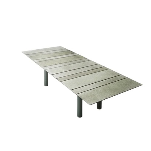 Contemporary dining table featuring a spacious slatted surface and sturdy cylindrical legs, designed for a clean and refined look in versatile settings.