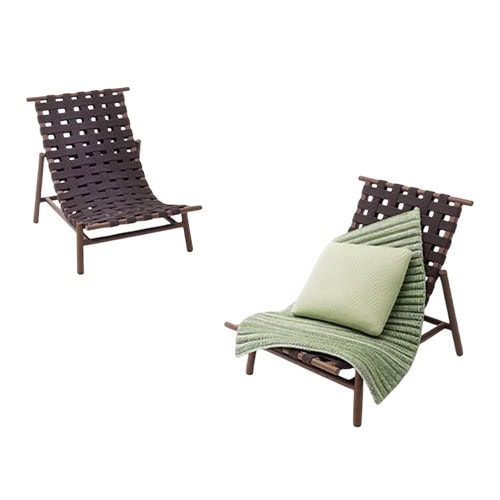 Pair of contemporary lounge chairs featuring dark woven seats, accented by a green cushion and blanket for a touch of comfort and style.