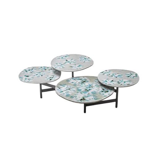This artistic side table features four overlapping circular tops adorned with soft blue and white patterns, evoking the beauty of blooming petals.