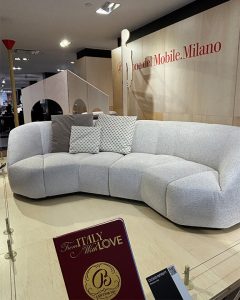 Large gray sofa in a showroom.