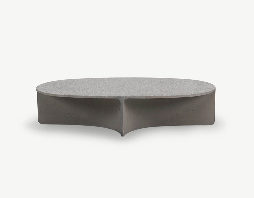 An oval light grey coffee table with a sculpted dark grey base featuring a soft triangular recess at the center.