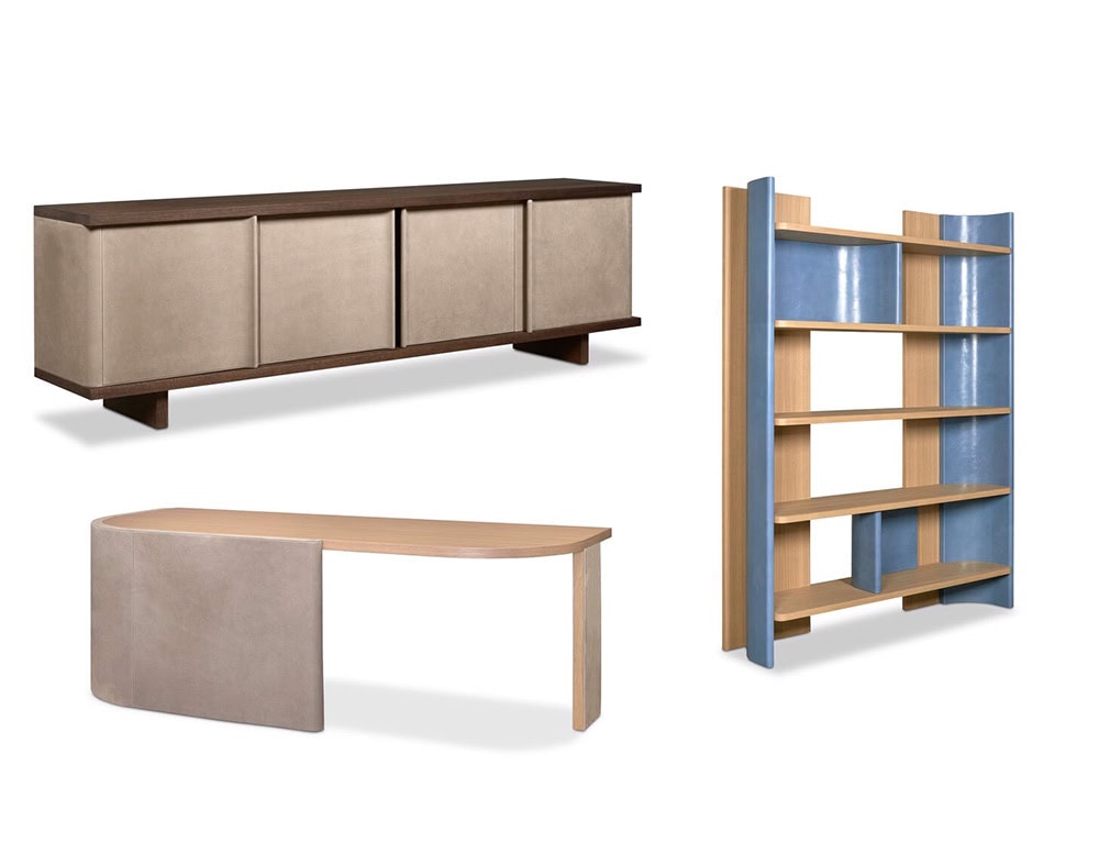 A storage sideboard with soft-textured panels is paired with an open bookshelf in wood and blue lacquer. A matching desk with a pale top and rounded base complements the set.