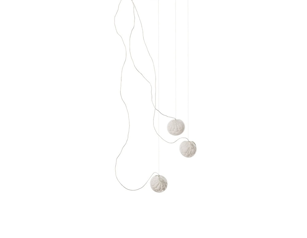 The Boc 118 Series pendant light features three delicate hand-blown glass spheres suspended on fine cables, creating an airy and sculptural lighting composition.