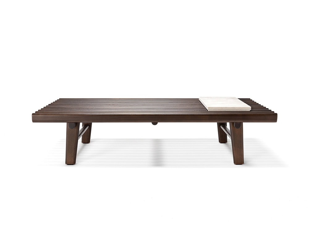 The Ext Elba Coffee Table Outdoor pairs a refined slatted wood surface with a clean-lined frame, creating a versatile platform for outdoor living that balances functionality and relaxed elegance.