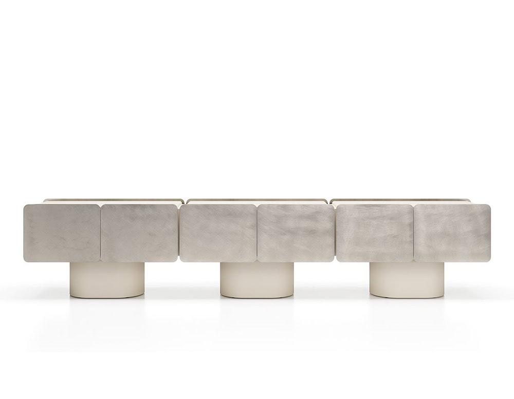 GR Admira Cabinet shown with soft silver-toned panels and pale cream cylindrical bases. Its extended modular form blends sculptural elegance with a refined material palette.