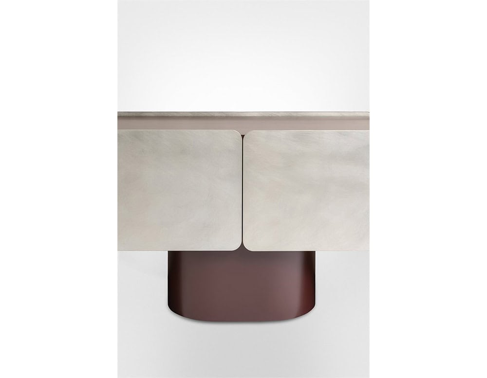 GR Admira Cabinet detail highlighting its brushed metallic front and rounded matte burgundy base for a bold contrast.
