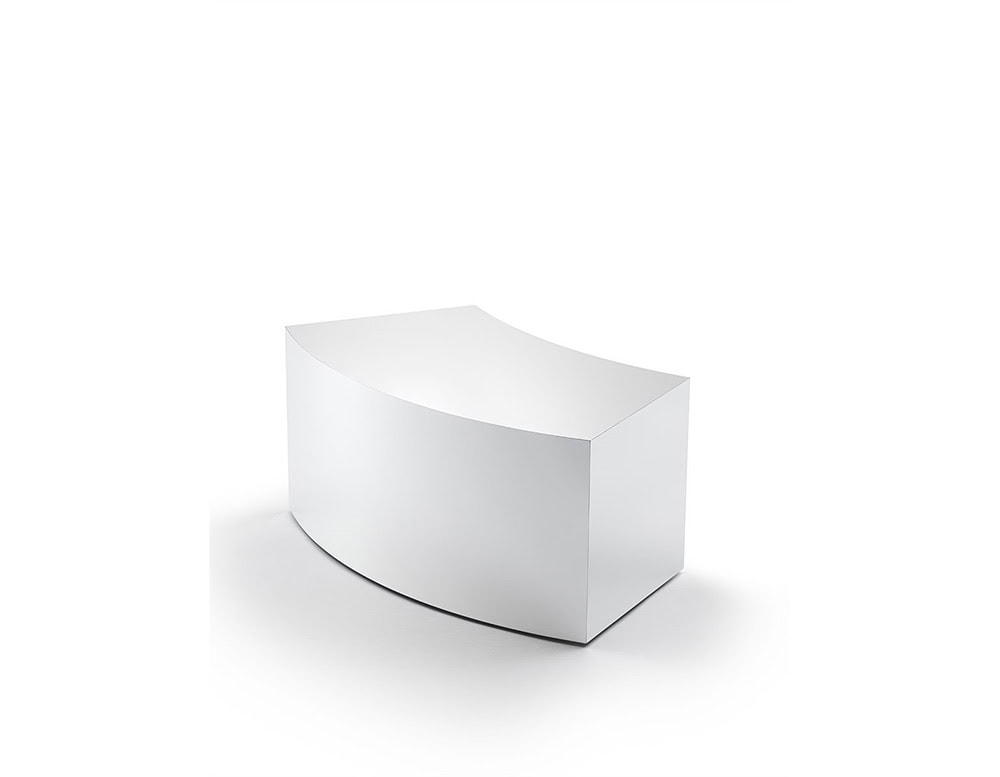 A sculptural coffee table in a white lacquered finish, featuring a smooth curved profile and crisp geometric lines for a minimalist aesthetic.