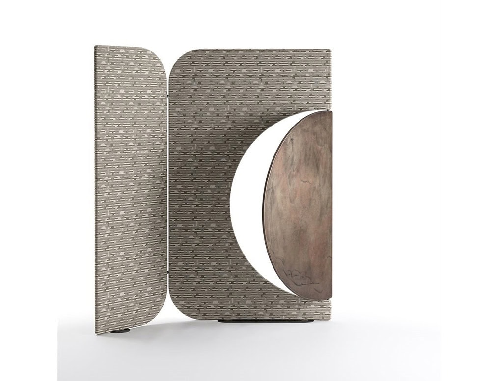 The Enso Screen presents a minimalist pattern in soft taupe tones, with a warm brown circular wood element that rotates to transform the composition. Its versatile shape enhances both modern and organic interiors.