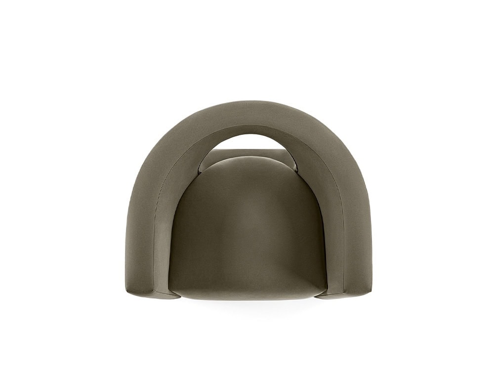 The GR H2O Lounge Chair showcases a circular cut-out back and a fully upholstered frame. The subtle earthy tone enhances its sculptural silhouette.