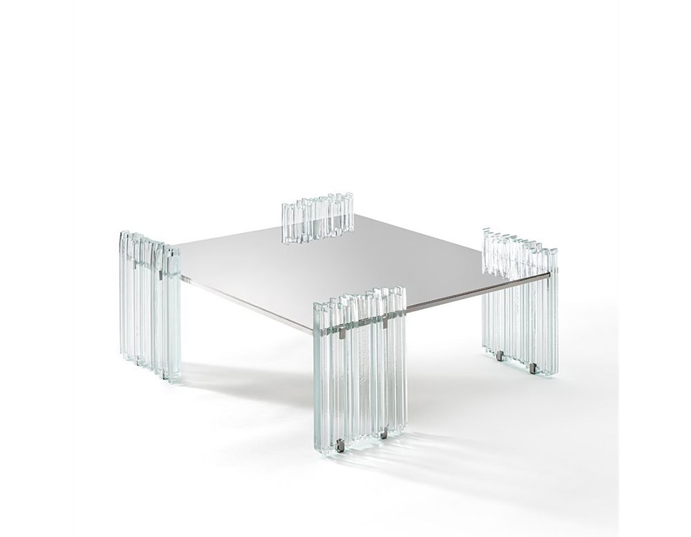GR Mirage Coffee Table with a square mirrored top and glass rod legs is featured. The design highlights its clean, reflective aesthetic, set against a white background for a minimal, luminous presentation.