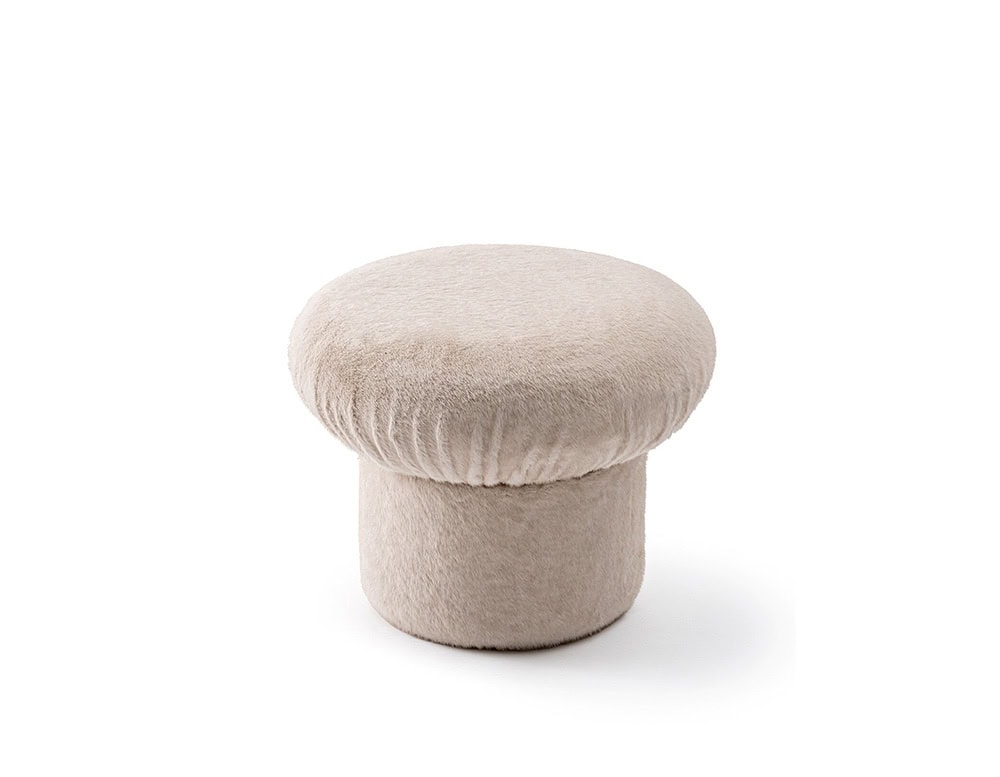 GR Nala Stool in pale beige fabric, set against a clean white background. Its rounded cushioned top and soft texture give it a plush, cozy appearance.