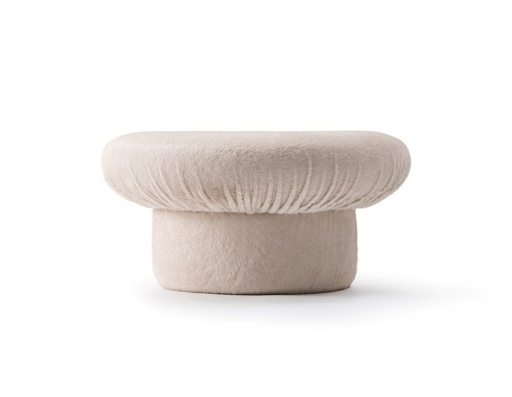 GR Nala Stool in pale beige fabric, presented against a clean white background. The wide, rounded cushioned top and soft texture give it a plush, cozy appearance.