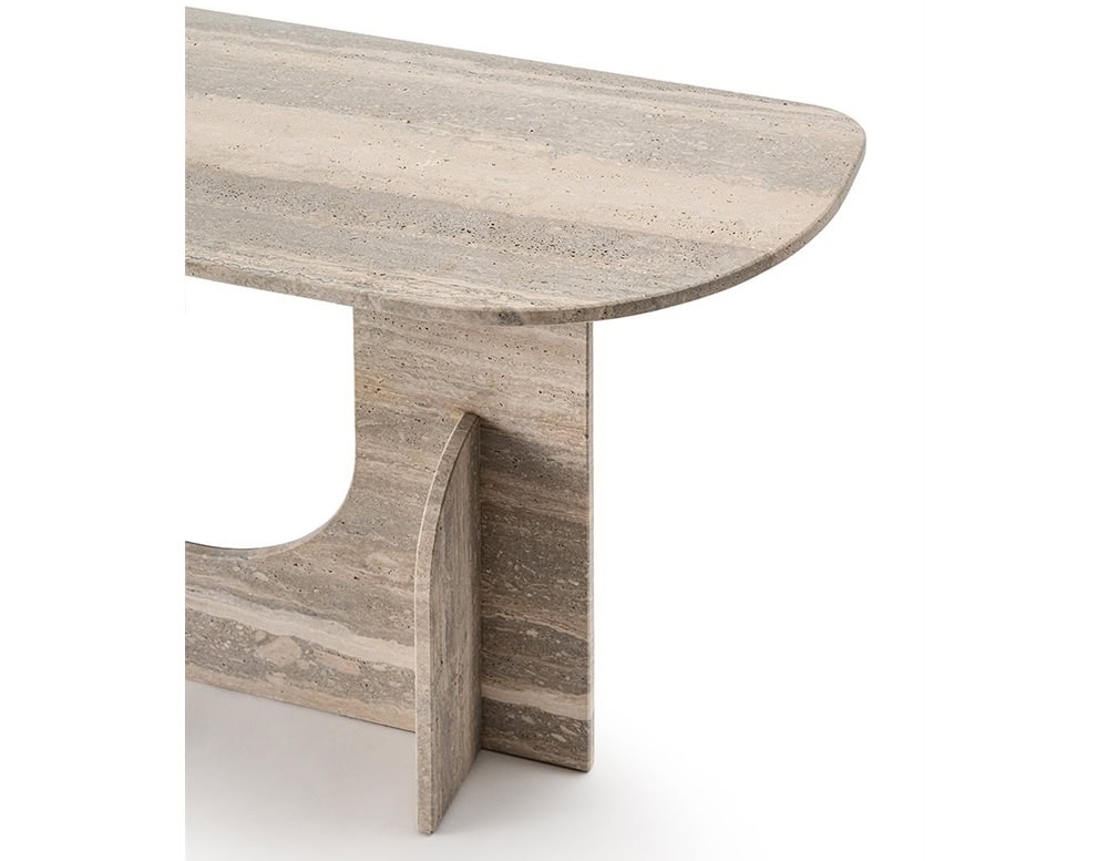 The GR Selce Console Table highlights its chamfered travertine top and softly rounded edge. Warm taupe striations run horizontally across the stone, emphasizing the natural veining.