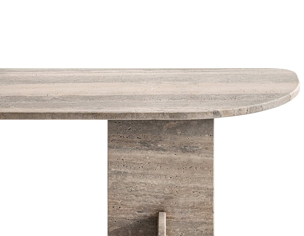 The GR Selce Console Table highlights a close-up of its softly rounded travertine top, revealing intricate stone textures and subtle veining that emphasize its artisanal craftsmanship.