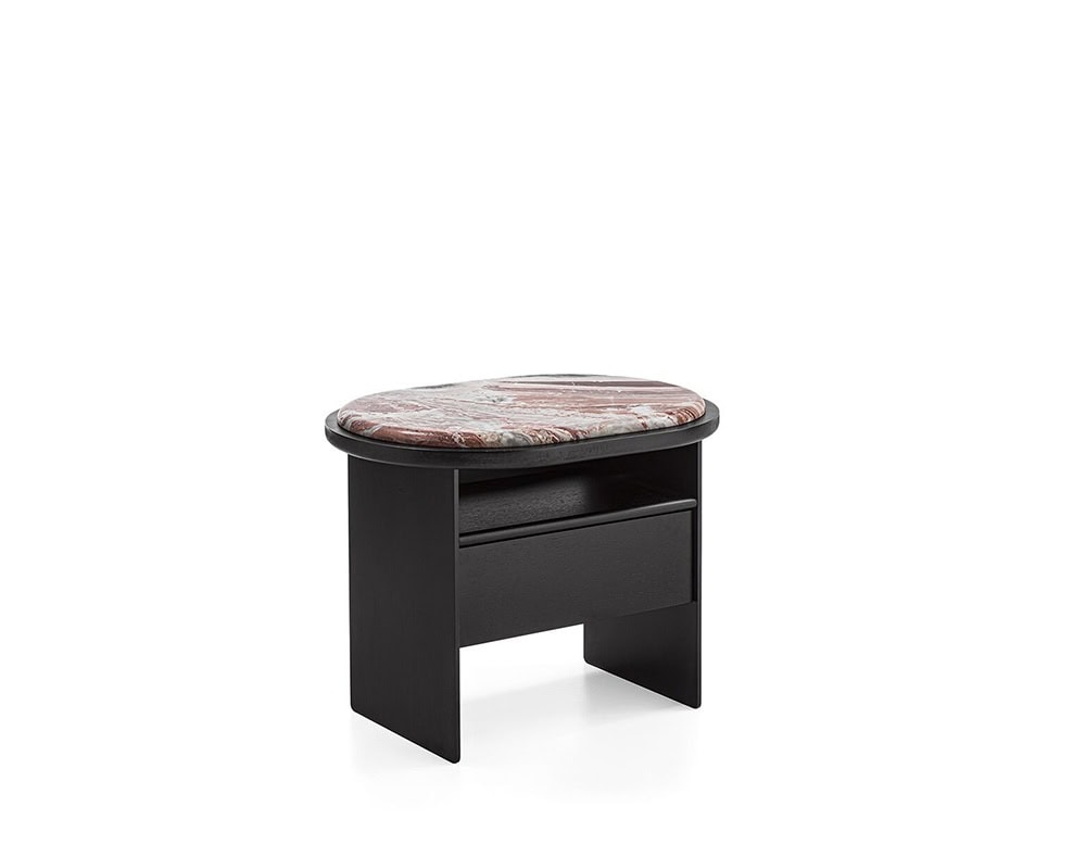 The GR Sensei Night Table pairs a dark wood base with a sculptural, rounded top in rose-toned marble. Its soft profile contrasts with clean lines, creating a refined bedside accent with subtle storage.