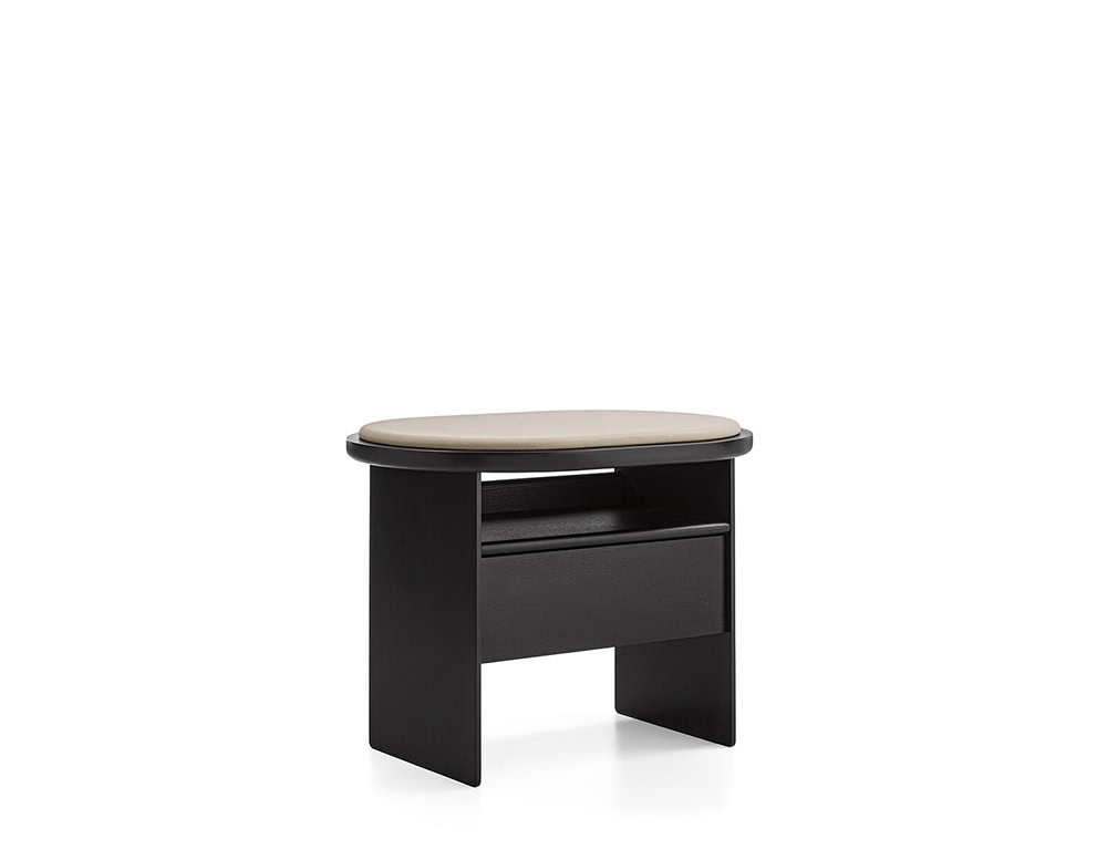 The GR Sensei Night Table features a smooth taupe leather top paired with a deep black oak base. Its soft oval shape and minimalist lines blend storage and design, offering a refined, contemporary bedside solution.