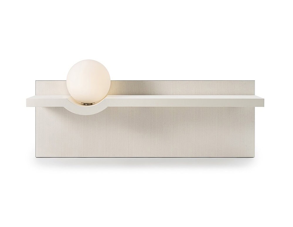 The GR Stresa Console Table presents a soft off-white finish, with a sculptural light sphere nestled into the shelf. Its minimalist design adds quiet elegance and illumination to a refined interior.