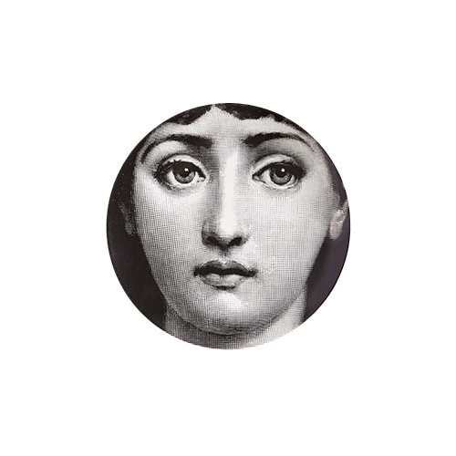 Iconic black and white plate featuring an enigmatic face, bringing timeless elegance and artistic intrigue to any space or table setting.
