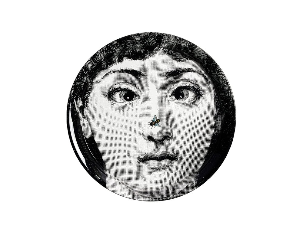 Round tray featuring a striking female face in classic illustration style, accented with a realistic fly on the nose. A bold, surrealist conversation piece.