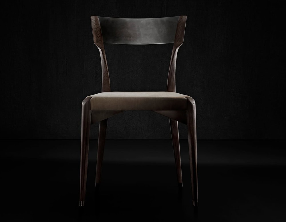 The Hen Chair VA features an elegantly contoured wood backrest and a plush seat in a smooth velvet finish. Refined craftsmanship and ergonomic design elevate its presence in both classic and modern interiors.