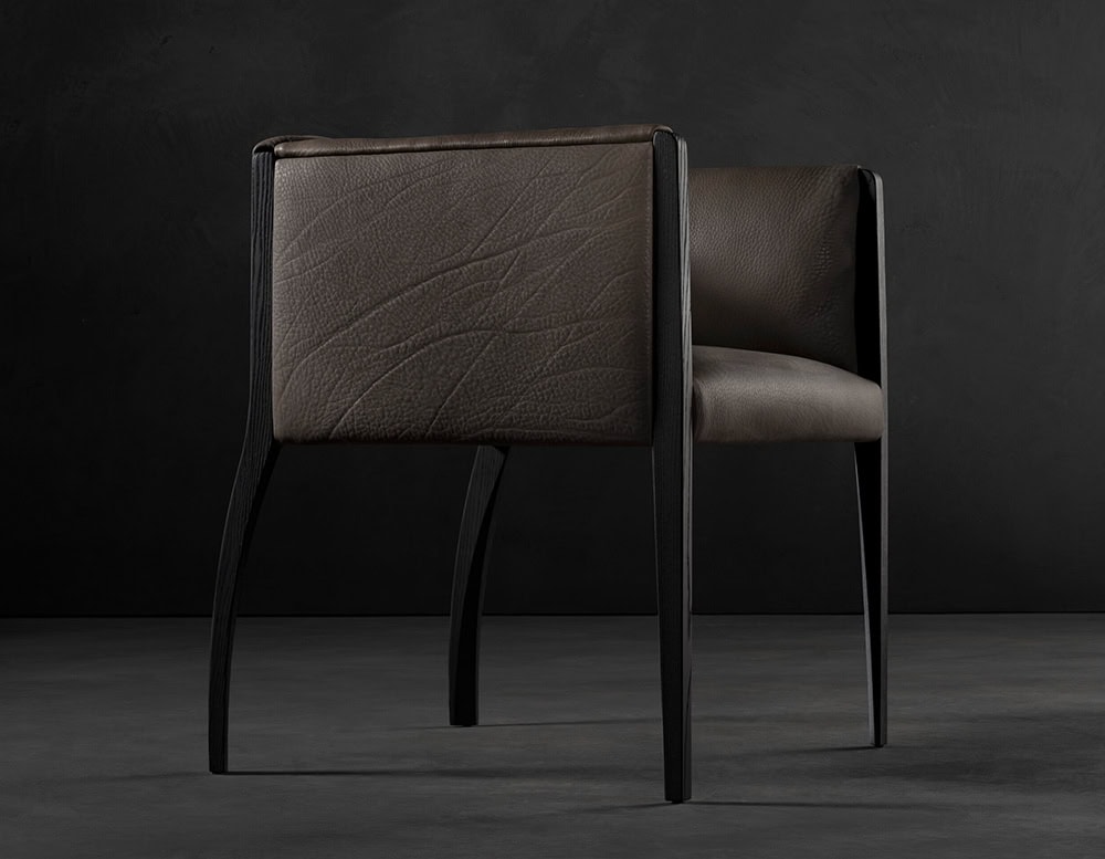 The Hen Shelly Chair pairs a structured vertical frame with supple leather upholstery, while the backrest’s rich texture and stitching offer a sophisticated, tactile finish.
