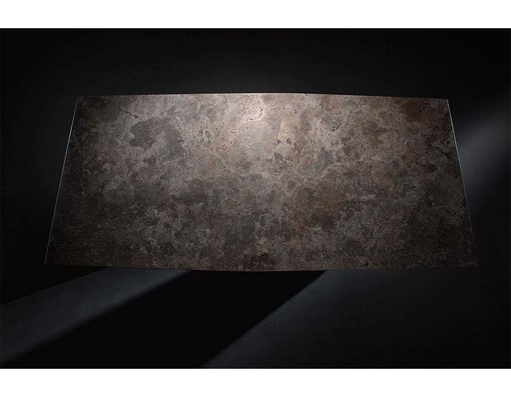 Hen Sisma Dining Table features a bold stone top with a rich organic texture offering an elegant and grounded focal point for any contemporary dining space.