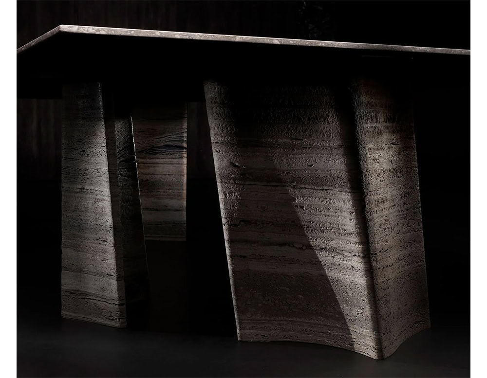 Hen Sisma Dining Table showcases sculptural stone legs with fluid lines and a raw textured finish blending strength and elegance in a striking silhouette.