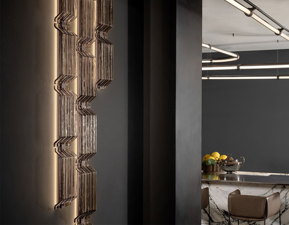 This Hen Vibe Wall Light features layered glass with dynamic zigzag contours and integrated backlighting. Its bold geometry and textured transparency create a refined focal point for contemporary interiors.