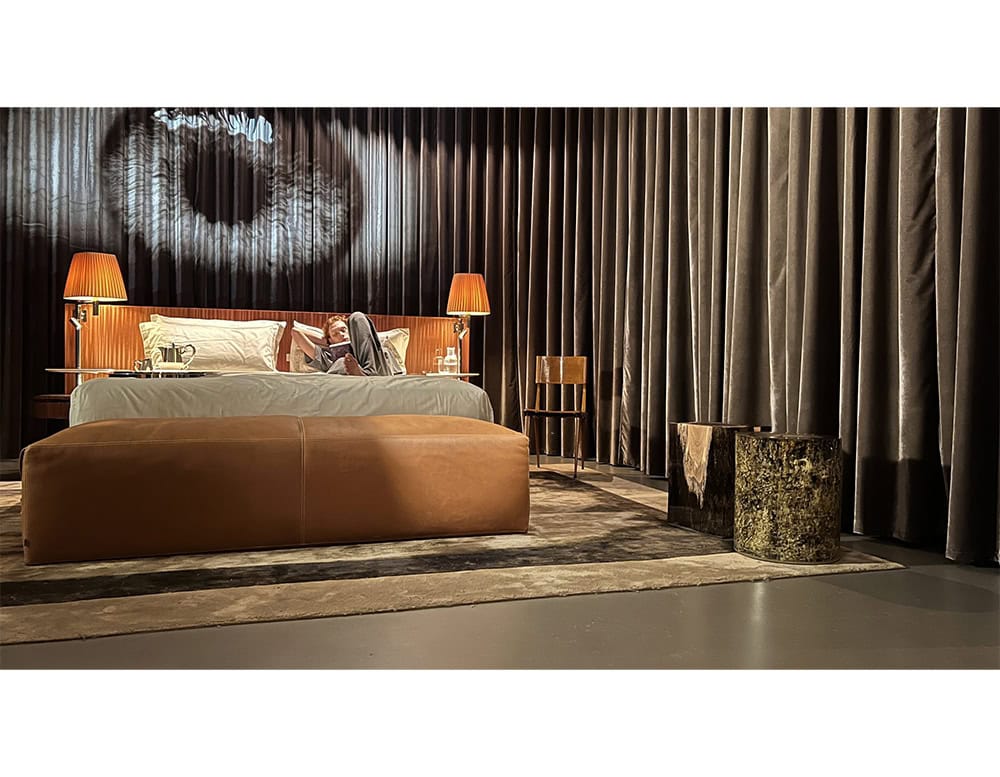 Two sculptural stools anchor the corner of the room. One evokes petrified wood, the other gleams with mossy gold resin. Earthy yet refined, they function as accent pieces or low seating.